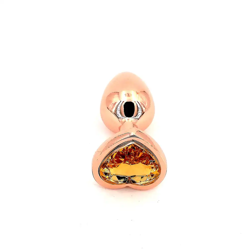 Gold heart-shaped butt plug with jewel