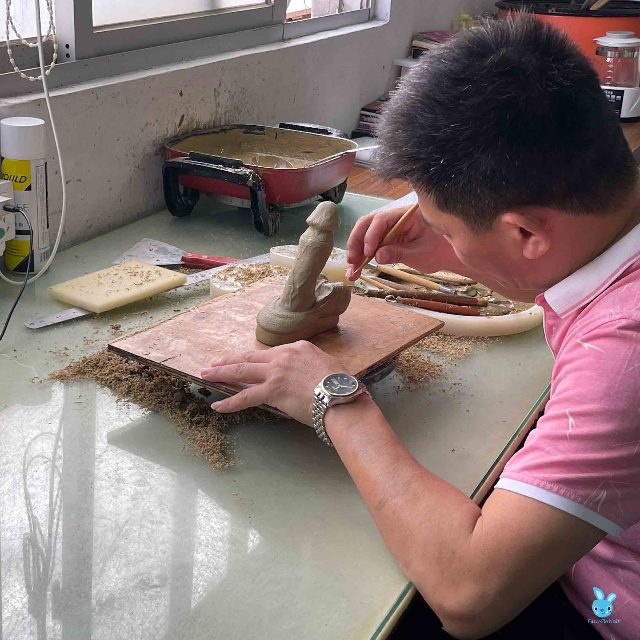 Carving a dildo clay pattern